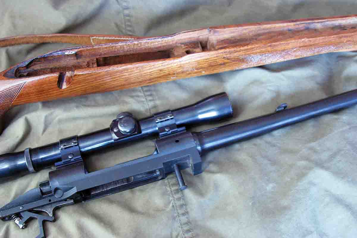 When the Model 70 Winchester appeared in 1937, the front action screw was behind the recoil lug, preventing the front of the action from bending as the screw is tightened. Most modern actions follow this screw placement.